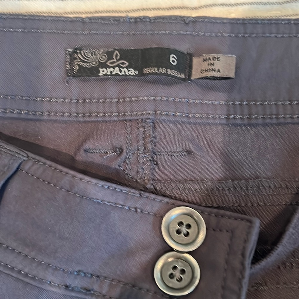 Prana grey pants can convert to shorts/capris. Excellent condition.